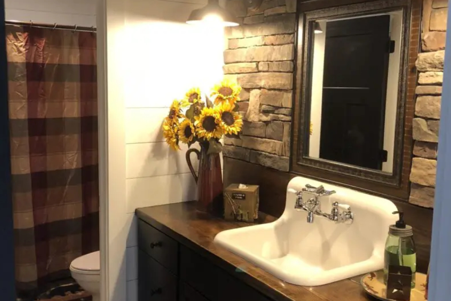 Bathroom sink area decorated with sunflowers