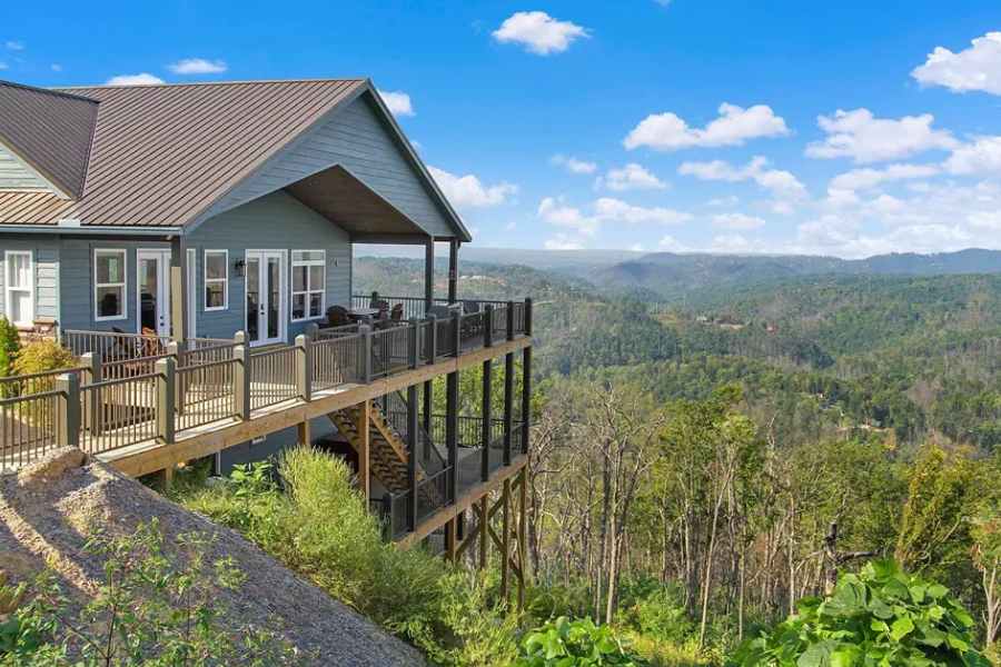 Hilltop property with a view of a forest