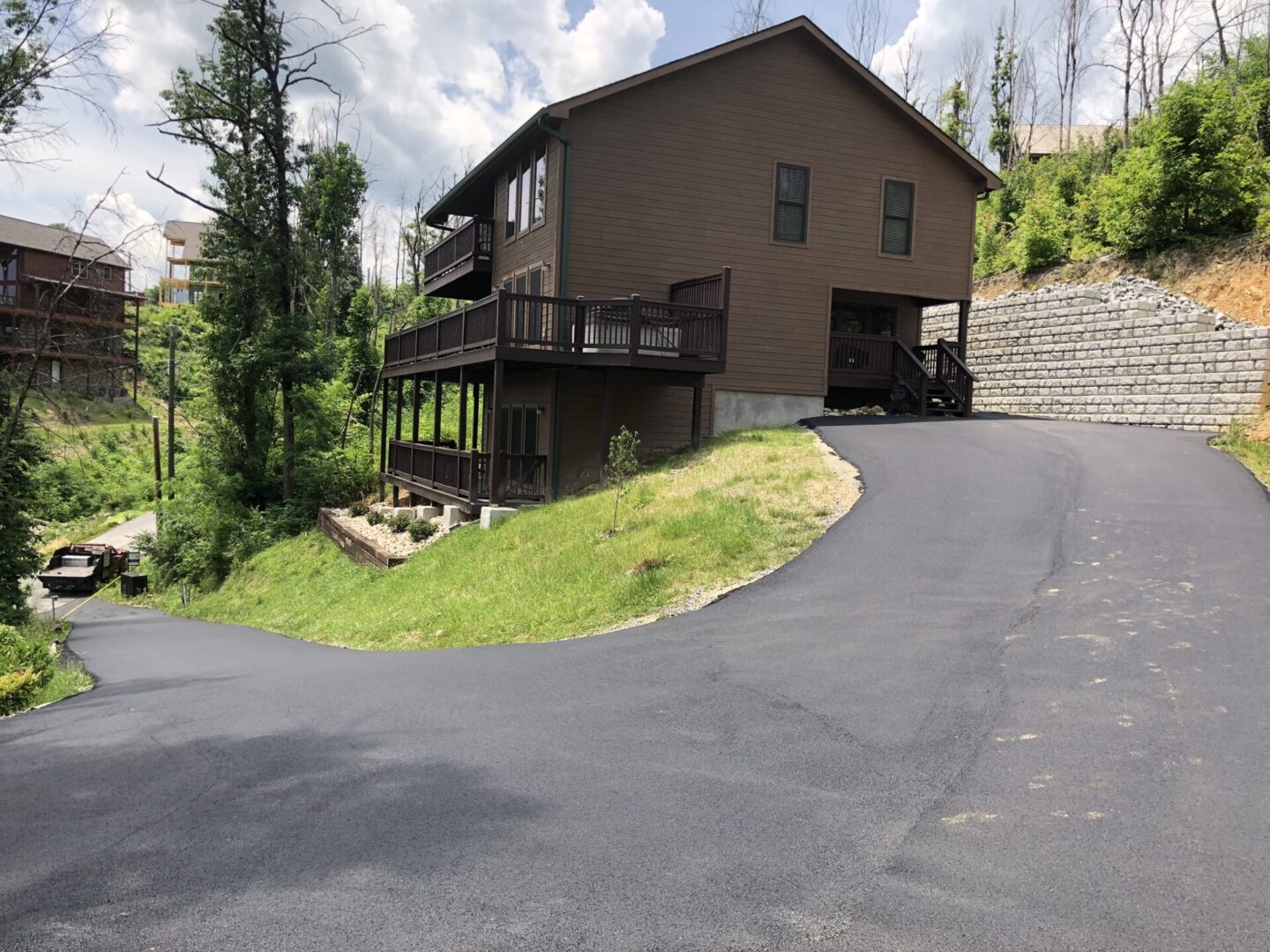 Driveway towards a residential property on a hill
